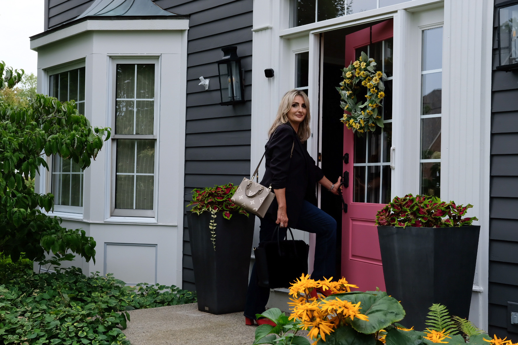 Maya Haddad standing at a home entrance